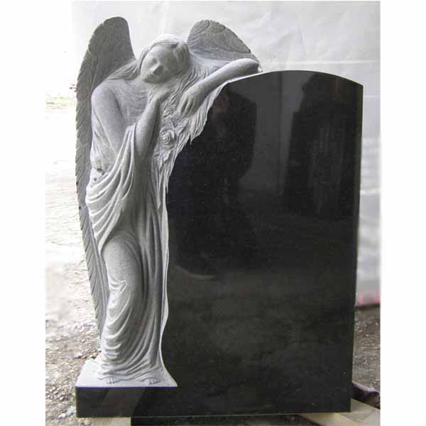 Фото памятника с ангелом вверху на надгробии